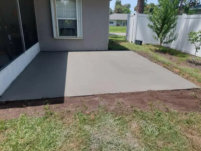 Concrete patio slab poured behind a home