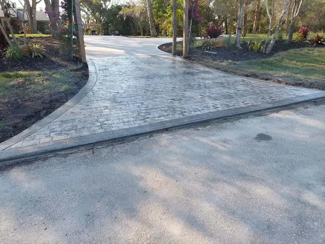 Stamped concrete paver driveway installed by Turfscapes
